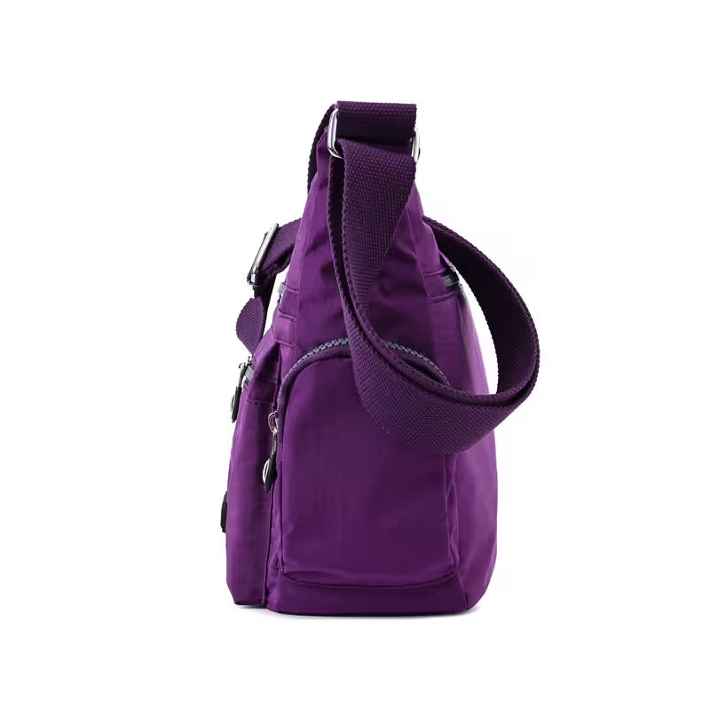 Purple shoulder bag on a white background