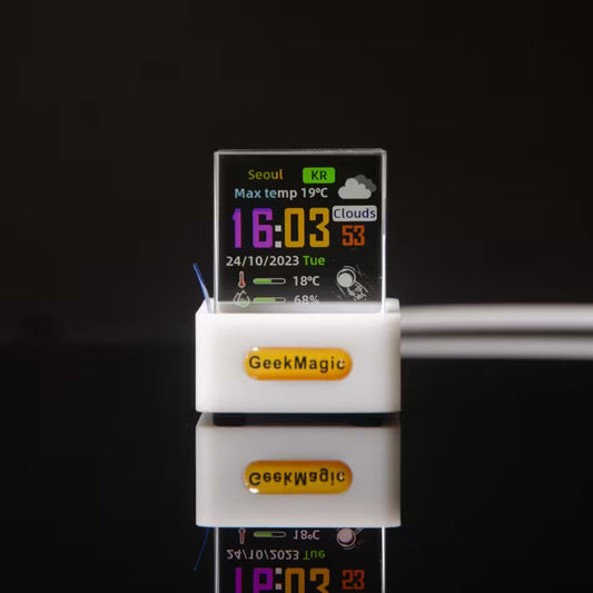 Digital clock with weather display and 'GeekMagic' branding on a black background