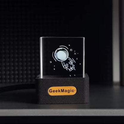 GeekMagic 3D laser engraving block with astronaut design on a black background