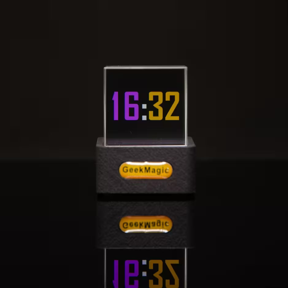 Digital clock with 'GeekMagic' branding on a black background