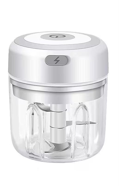 White handheld food chopper with clear container on a white background