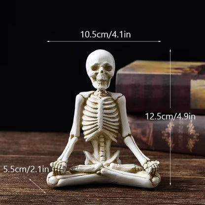Skeletal figure in a meditative pose with measurements on a dark background