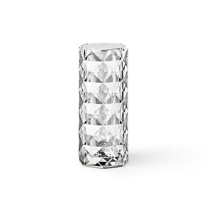 Clear glass vase with diamond-cut pattern on a white background