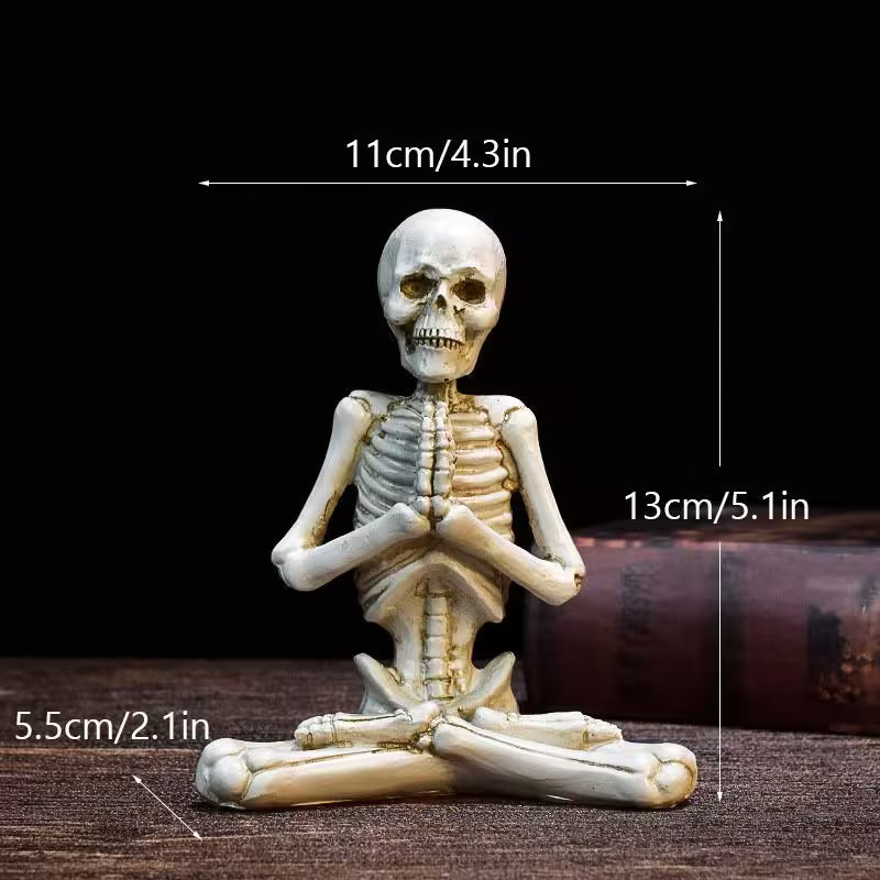 Skeletal figurine in a meditative pose with measurements on a dark background