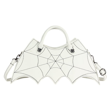 White handbag with spider web design on a white background