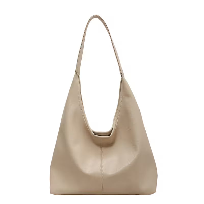 Beige handbag on a white background