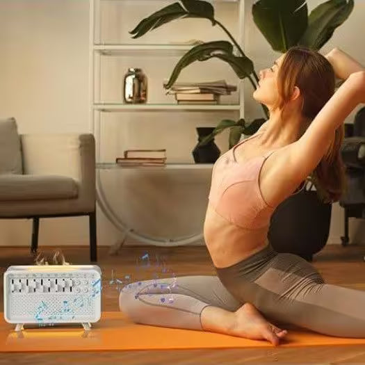 Woman practicing yoga with a white device emitting blue lights on an orange mat in a home setting.