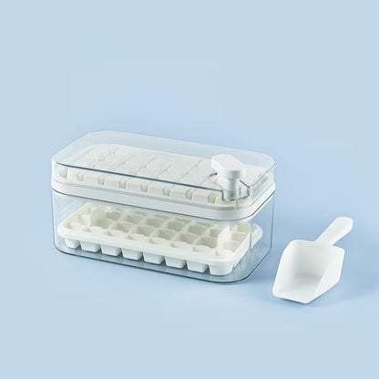 Ice cube tray with clear lid and white scoop on a light blue background