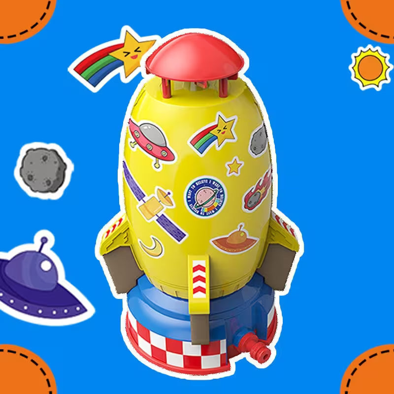 Colorful toy rocket with space-themed stickers on a blue background with space-themed decorations.