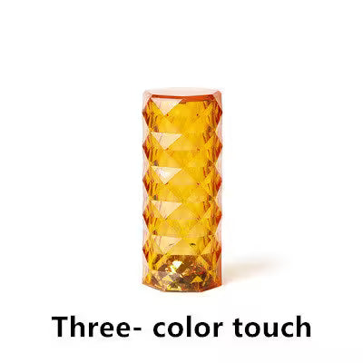 Amber glass vase with geometric pattern on a white background