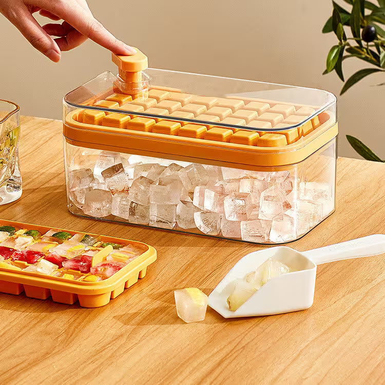 Yellow ice cube tray with clear container filled with ice cubes on a wooden surface.