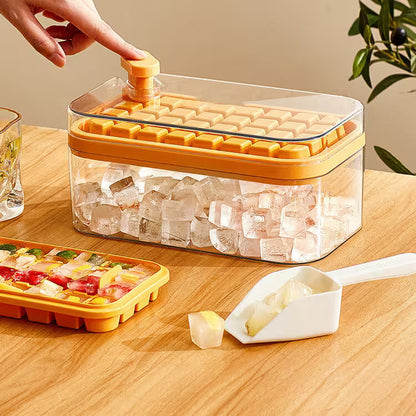 Yellow ice cube tray with clear container filled with ice cubes on a wooden surface.
